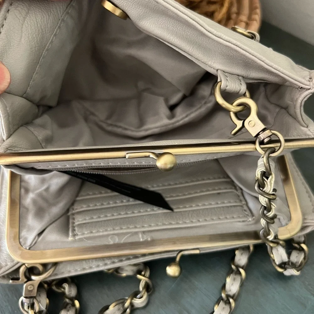 Anthropologie Grey Wallet Tumi leather Chain Crossbody bag.